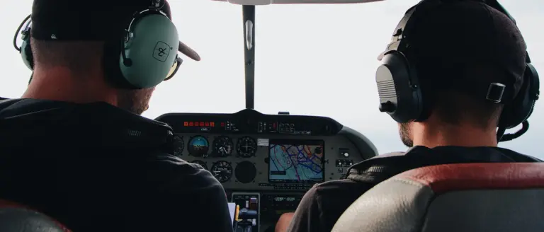 Flight instructor with student in the cockpit.